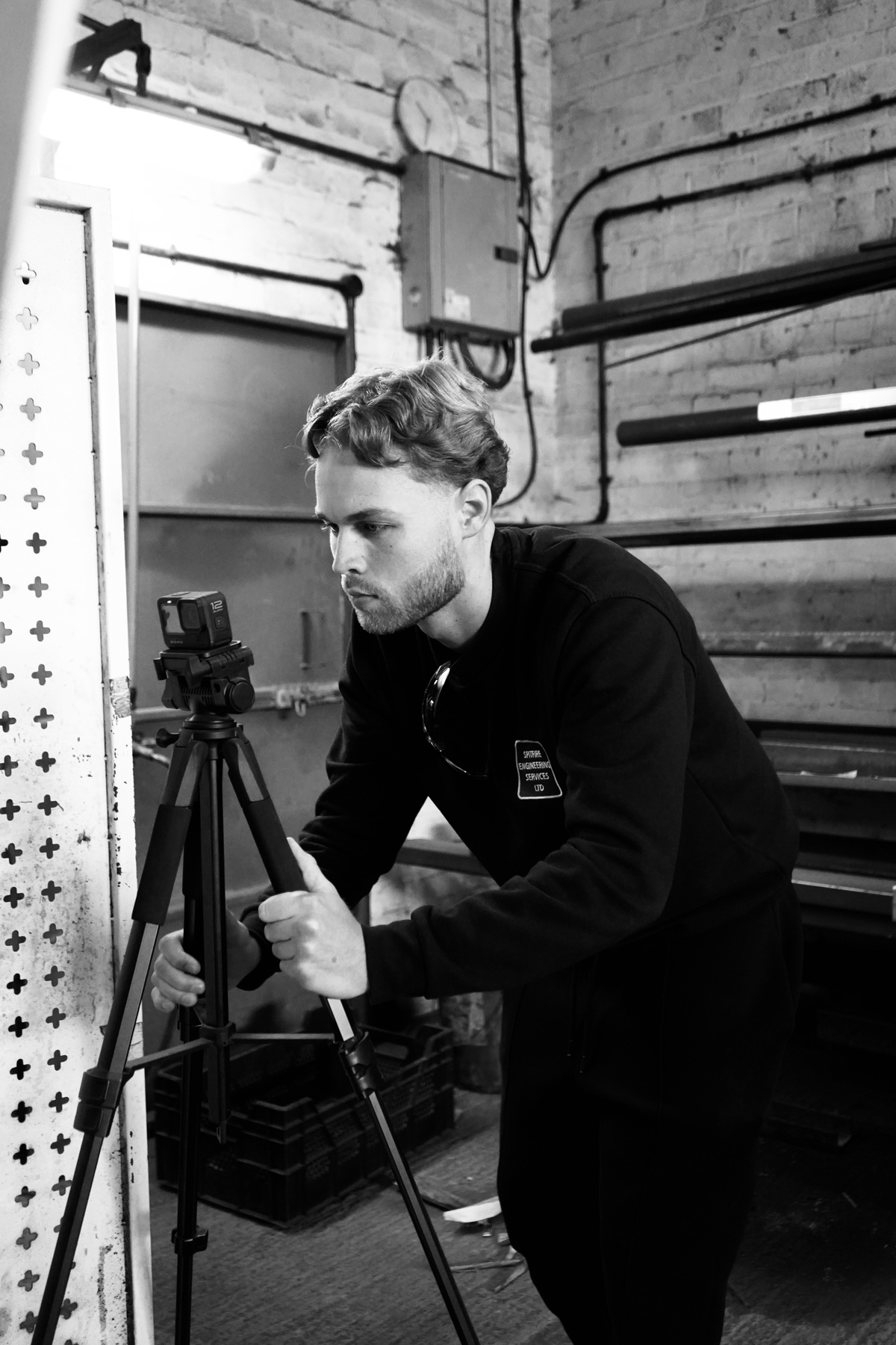 Adam Huber setting up a camera on location